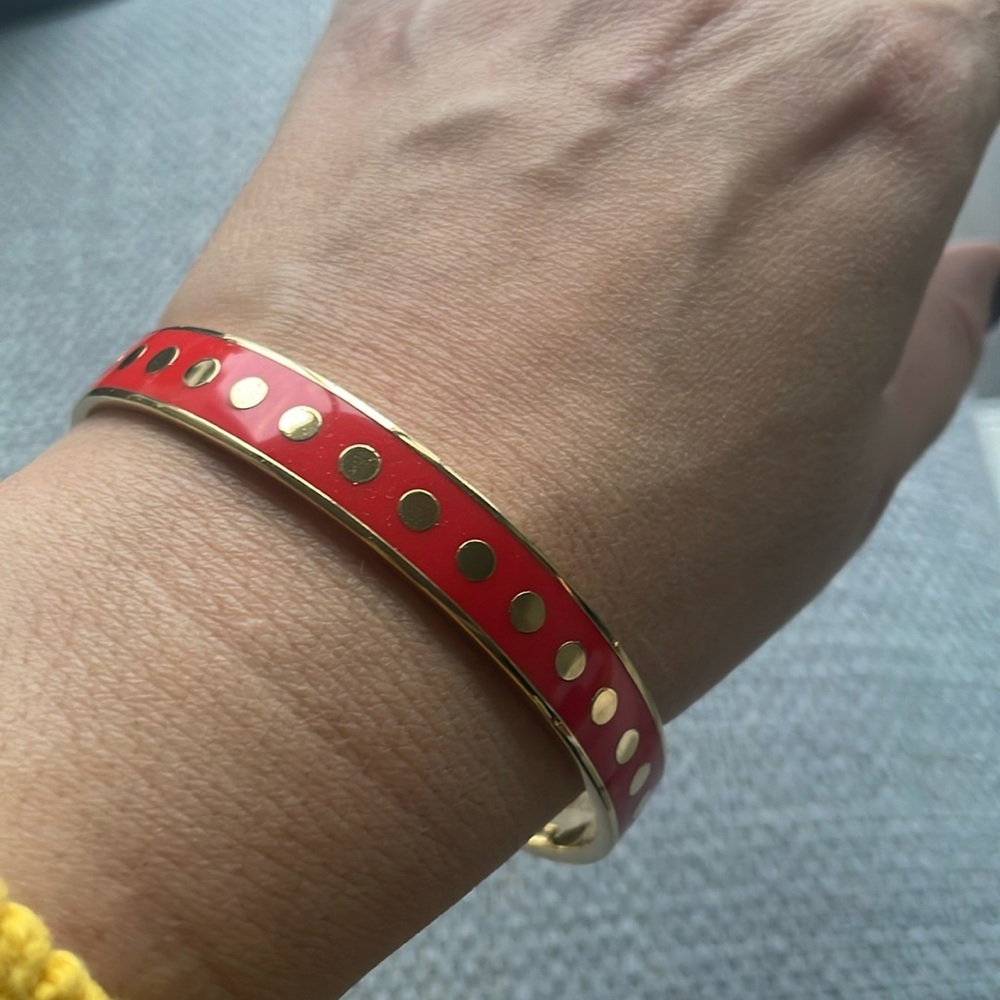 Kate Spade. Red and gold bangle